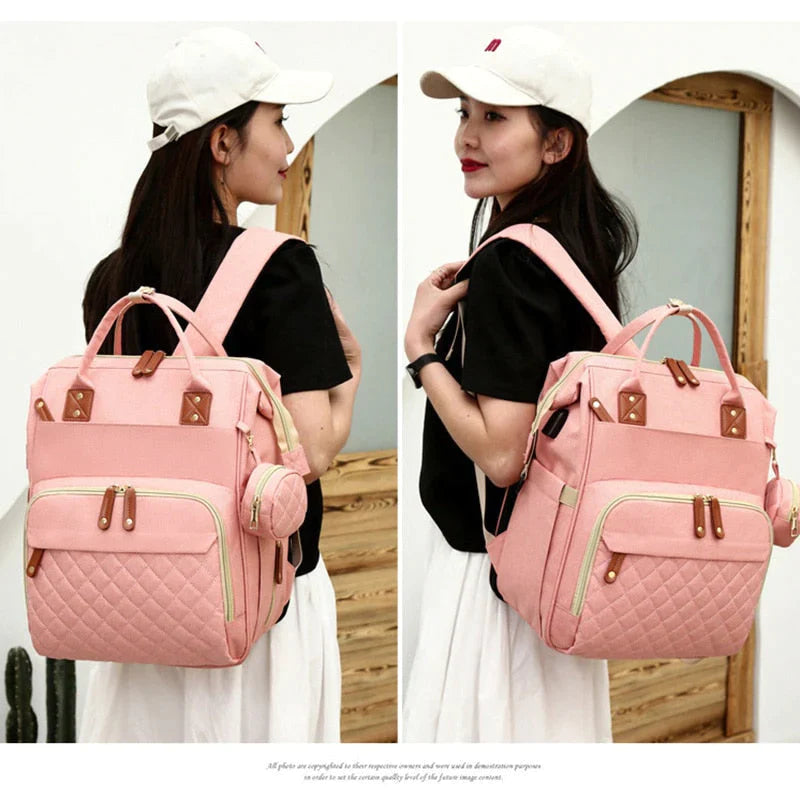 Diaper bag with foldable crib